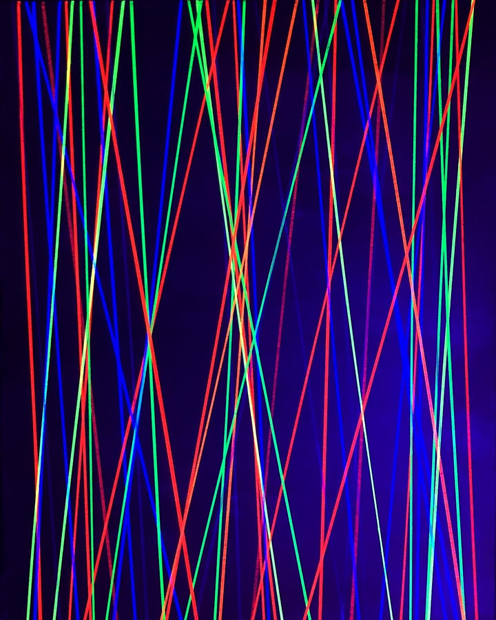 Metallic and fluorescent acrylics painting with green background and vertical lines, under UV light