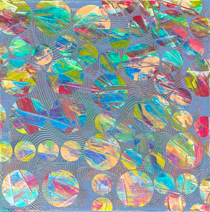 Metallic and fluorescent acrylics painting with colorful circles, under standard light