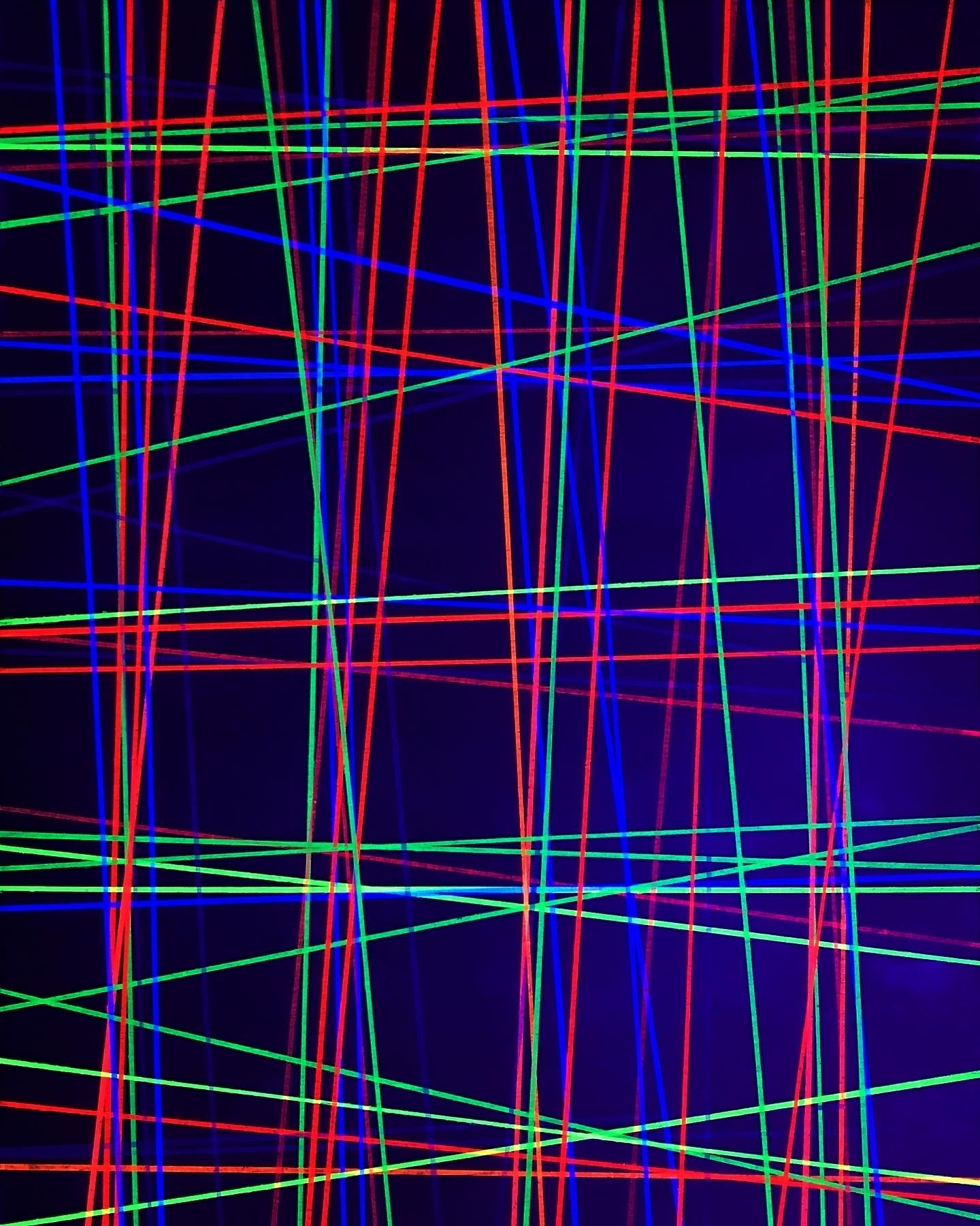 Metallic and fluorescent acrylics painting with green background and colorful lines, under UV light