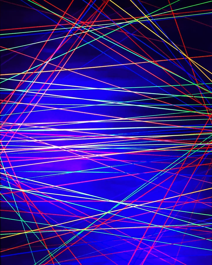 Metallic and fluorescent acrylics painting with blue and yellow background and colorful lines, under UV light